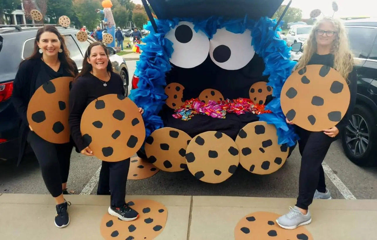 PTA volunteers with Cookie Monster at community event