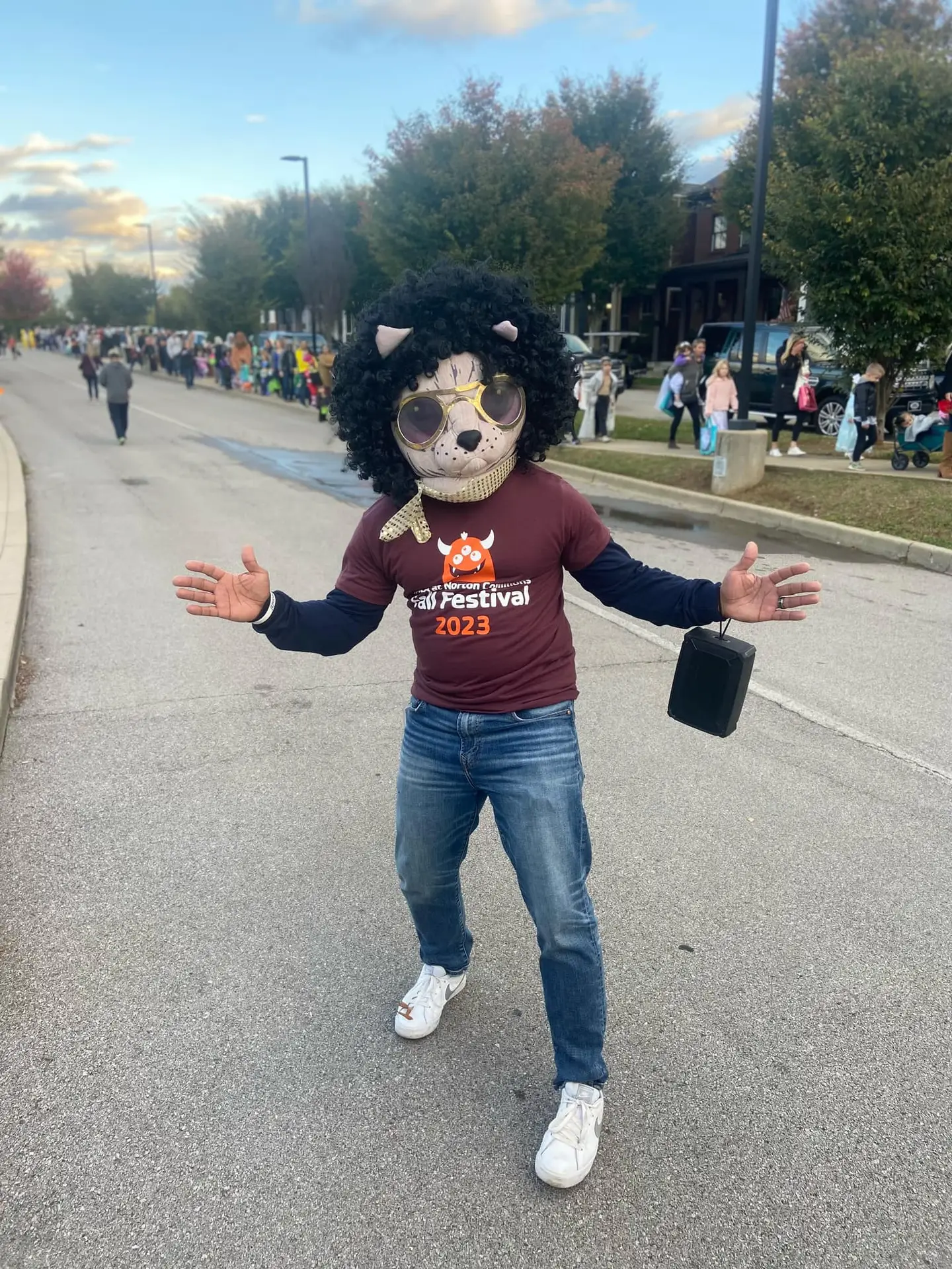 Community member in festive costume at school festival